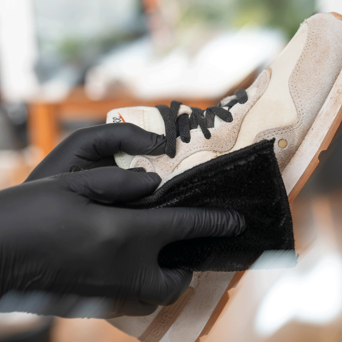 Detailing1 COLOURLOCK shoe & sneaker cleaners — cleaning a light-coloured sneaker with a pad