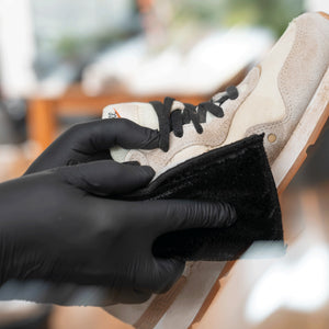 Detailing1 COLOURLOCK Sneaker Cleaner — cleaning a light-coloured sneaker with the cleaning pad
